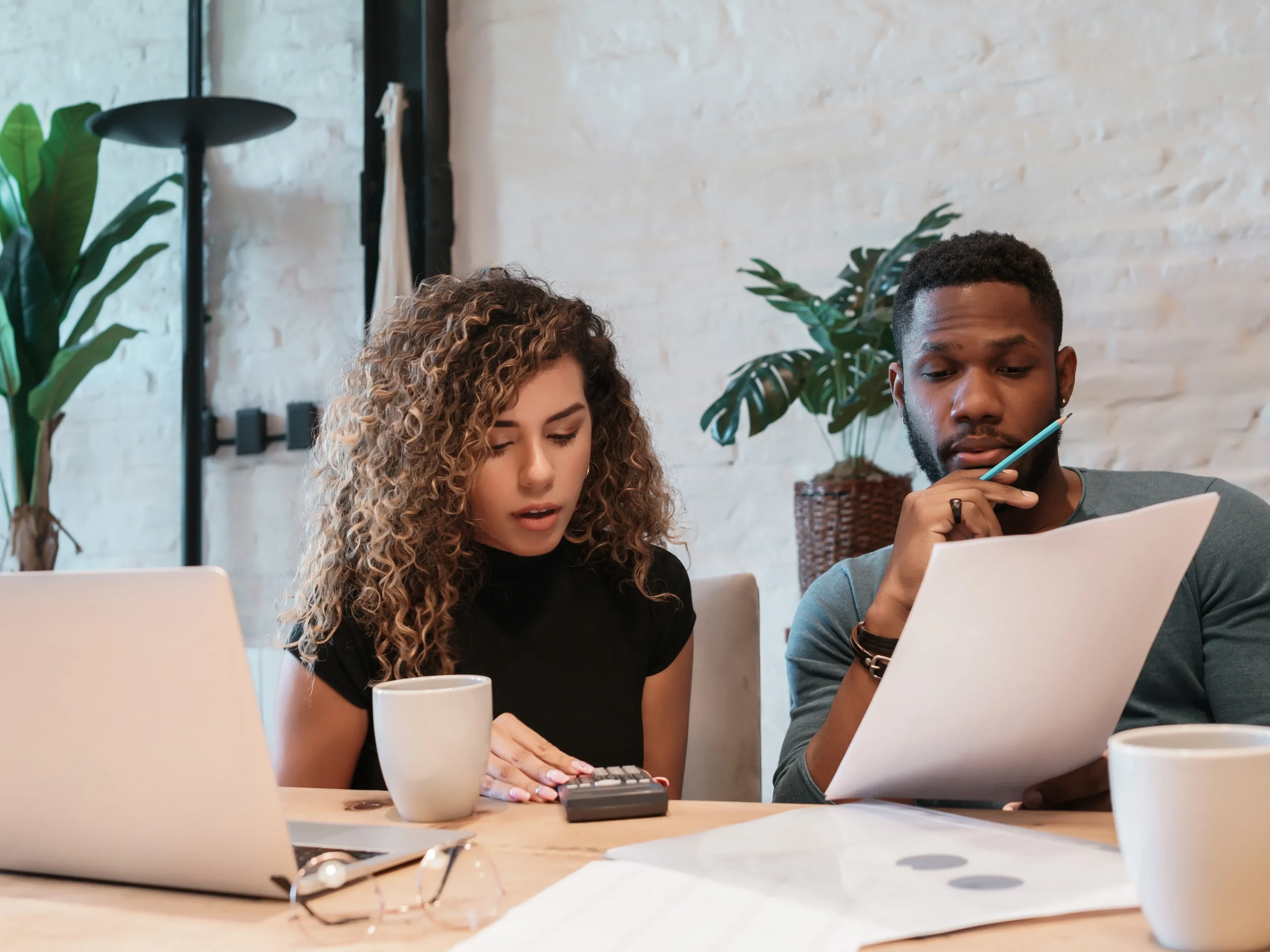 two people going over an advertising budget breakdown